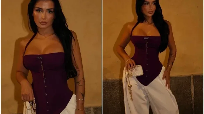 Xheneta Fetahu pozon me korset bordo dhe pantallona të bardha, kombinohet me çantë Chanel